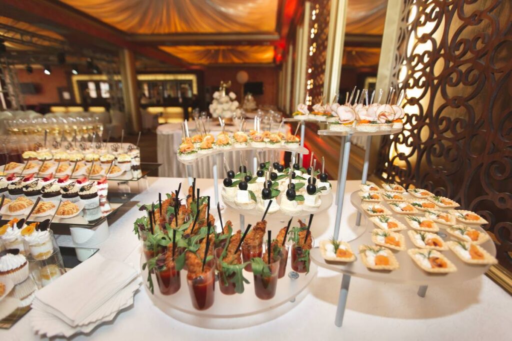 Catering table buffet dinner, beautifully decorated banquet with variety of different food snacks