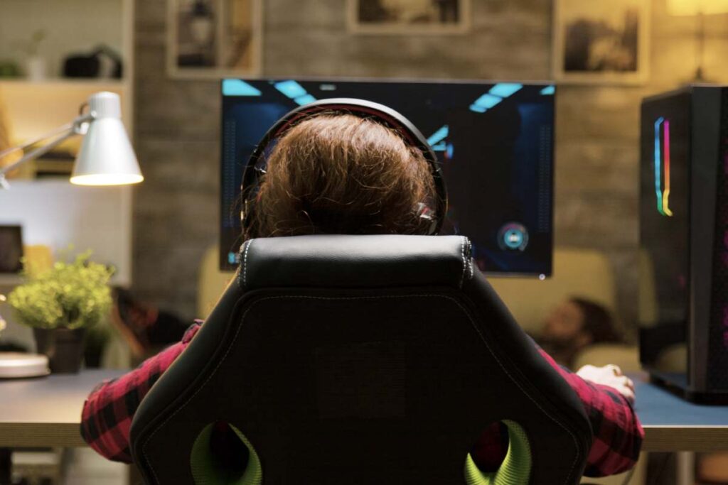 Dolly shot of woman sitting on gaming chair